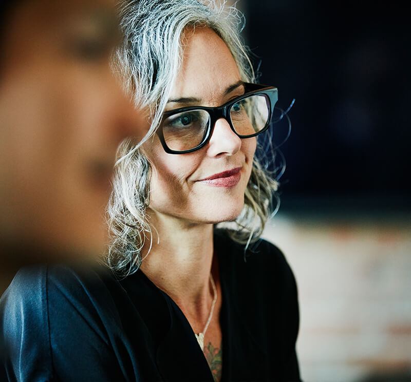 Woman smiling and listening