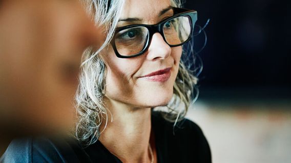 Woman smiling and listening